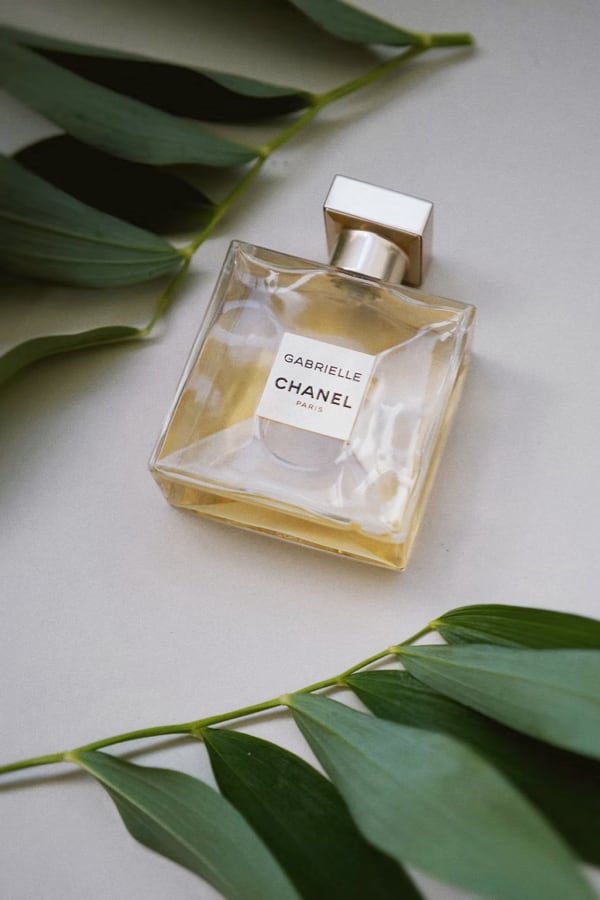 image of a perfume on the left